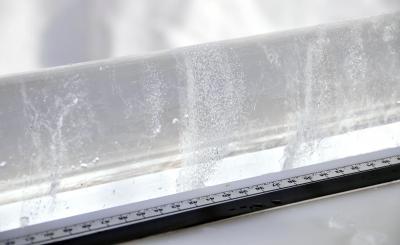  A section of ice core shows bands of bubbles frozen within the ice of McCall Glacier.